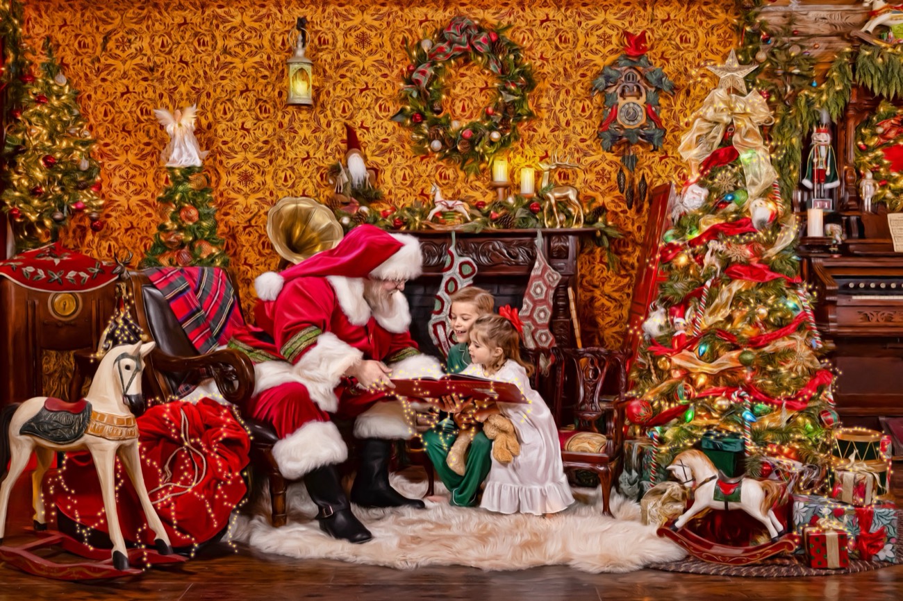 Commissioned art: Santa reading a storybook to children beside the Christmas tree